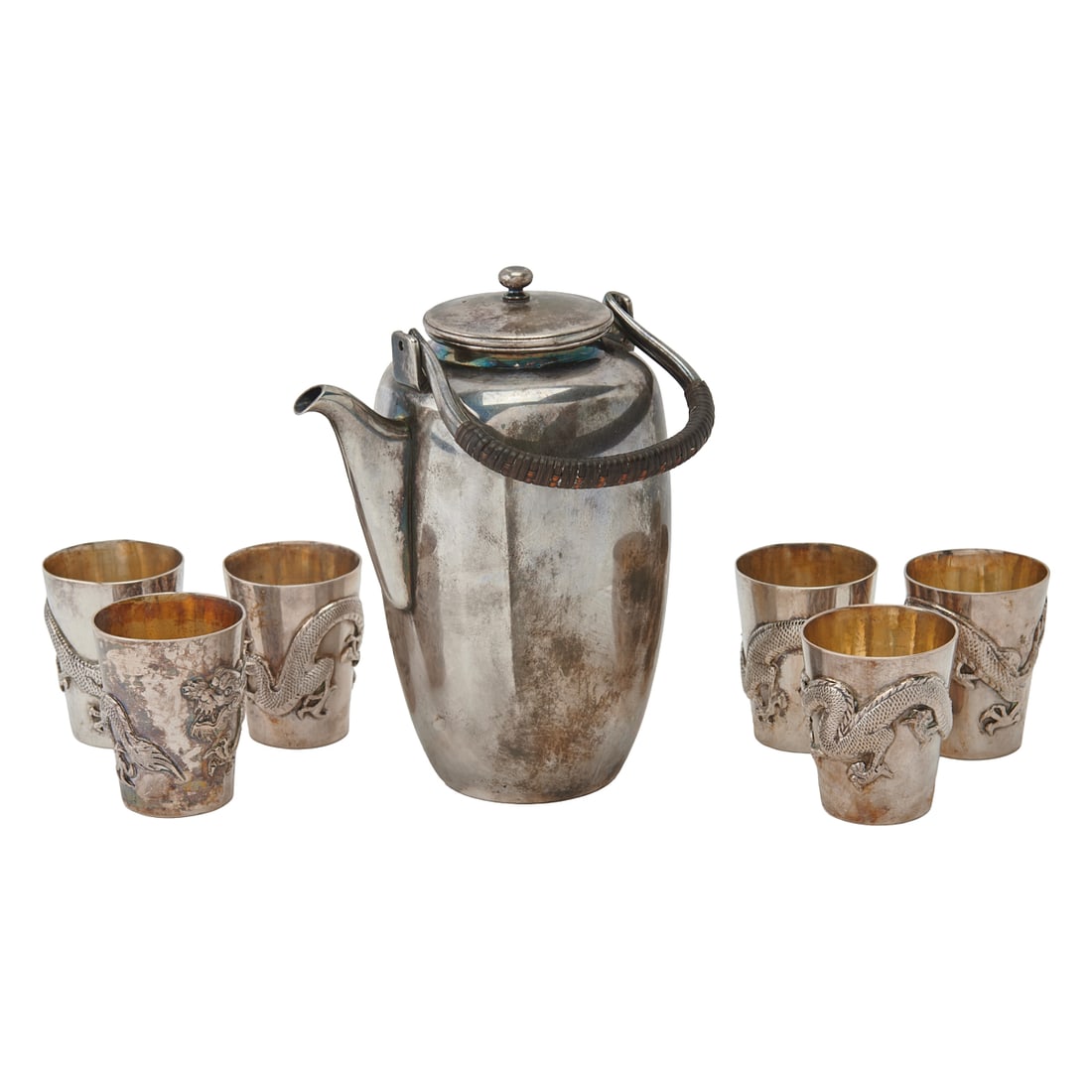 Asian Silver: Chinese Small Teapot and Japanese Cups: Asian Silver: Chinese Small Teapot and Japanese Cups comprising an HM Hung Chong Sterling Silver sauce pot and cover,; and six Japanese .900 Silver cups, cast with dragons in low relief to exteriors,