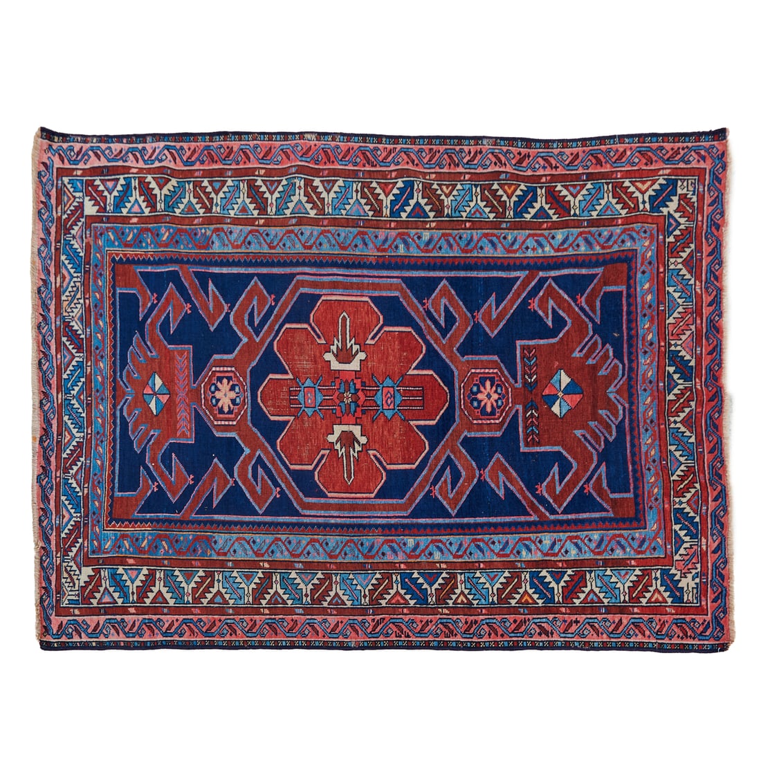Luri Caucasian Tribal Rug: Luri Caucasian Tribal Rug woven with wool and cotton, with red central medallion and stylized strapwork on the deep blue field, with triple border, alternating with varying slender guard band borders,