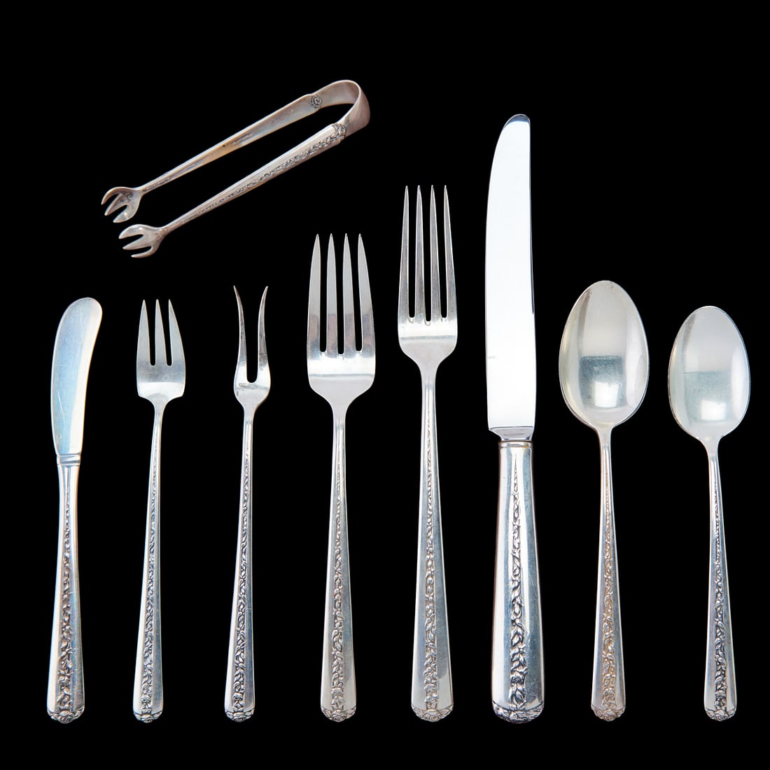 Towle Sterling Silver Flatware in the Rambler Rose Pattern: Towle Sterling Silver Flatware in the Rambler Rose Pattern, comprising four place knives, four place forks, eight salad forks, eight teaspoons, five coffee spoons,;three;butter knives, four canape
