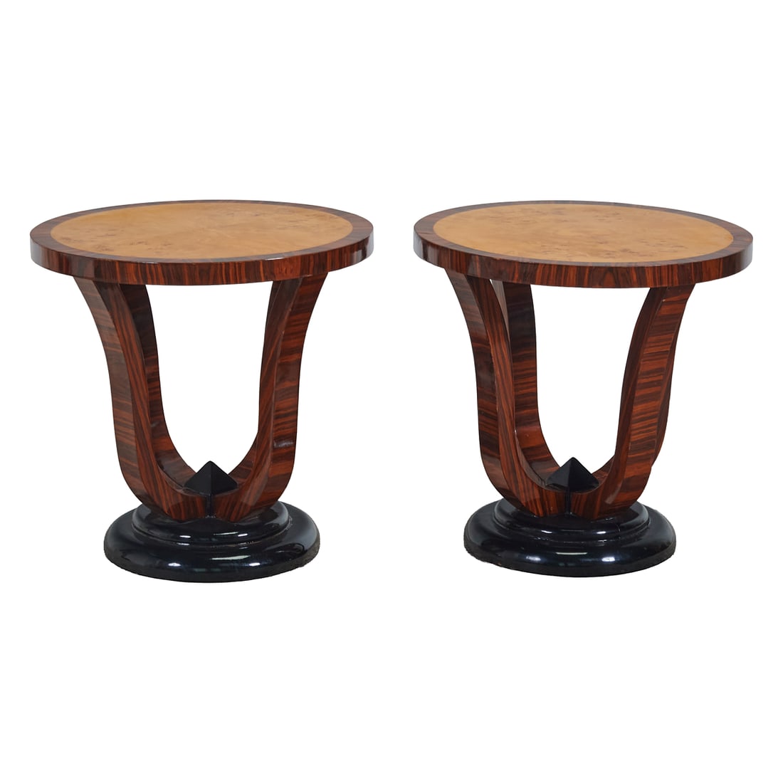 Pair of Art Deco Style Parcel Ebonized Tables: Pair of Art Deco Style Parcel Ebonized Tables, round tops with birds eye maple and rosewood veneer, over quadrupedal legs, conjoined at ebonized bases.;{Approximate dimensions: 23" H. x 23 1/2"