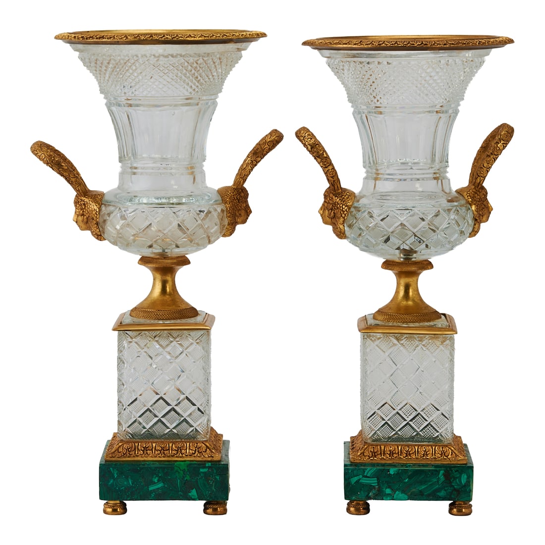 Pair of Bagues Style Cut Crystal Urns with Doré Bronze Mounts on Malachite Bases: Pair of Bagues Style Cut Crystal Urns with Doré Bronze Mounts on Malachite Bases.{Approximate dimensions - each: 18 1/2" H. x 10" W. x 8 3/8" D.}.