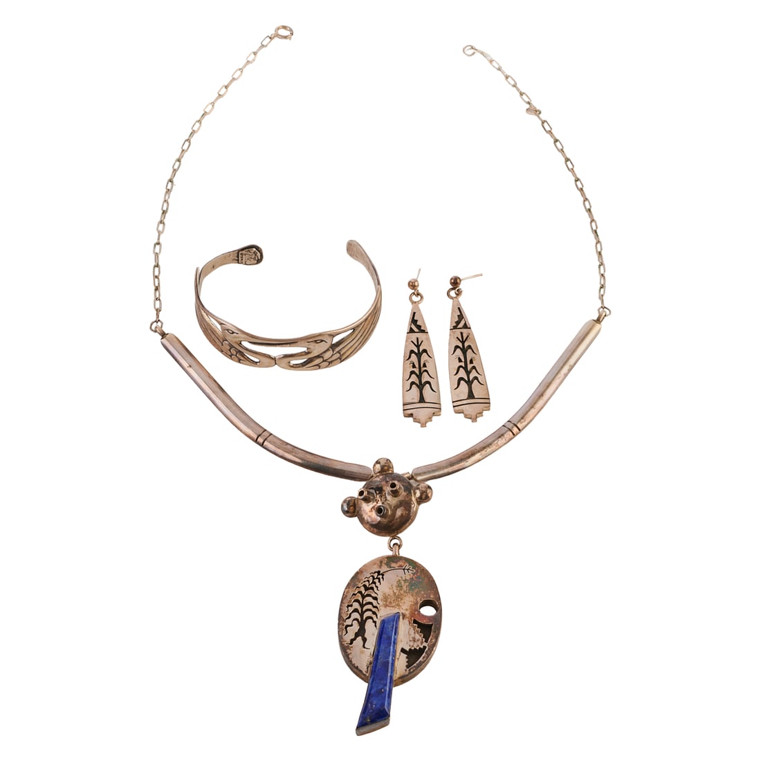 Native American Lapis Lazuli, Silver Jewelry Suite: Native American Lapis Lazuli, Silver Jewelry Suite. Including one lapis lazuli, sterling silver 19 1/2 inch necklace; one silver double bird motif cuff bracelet measuring approximately 58 mm in