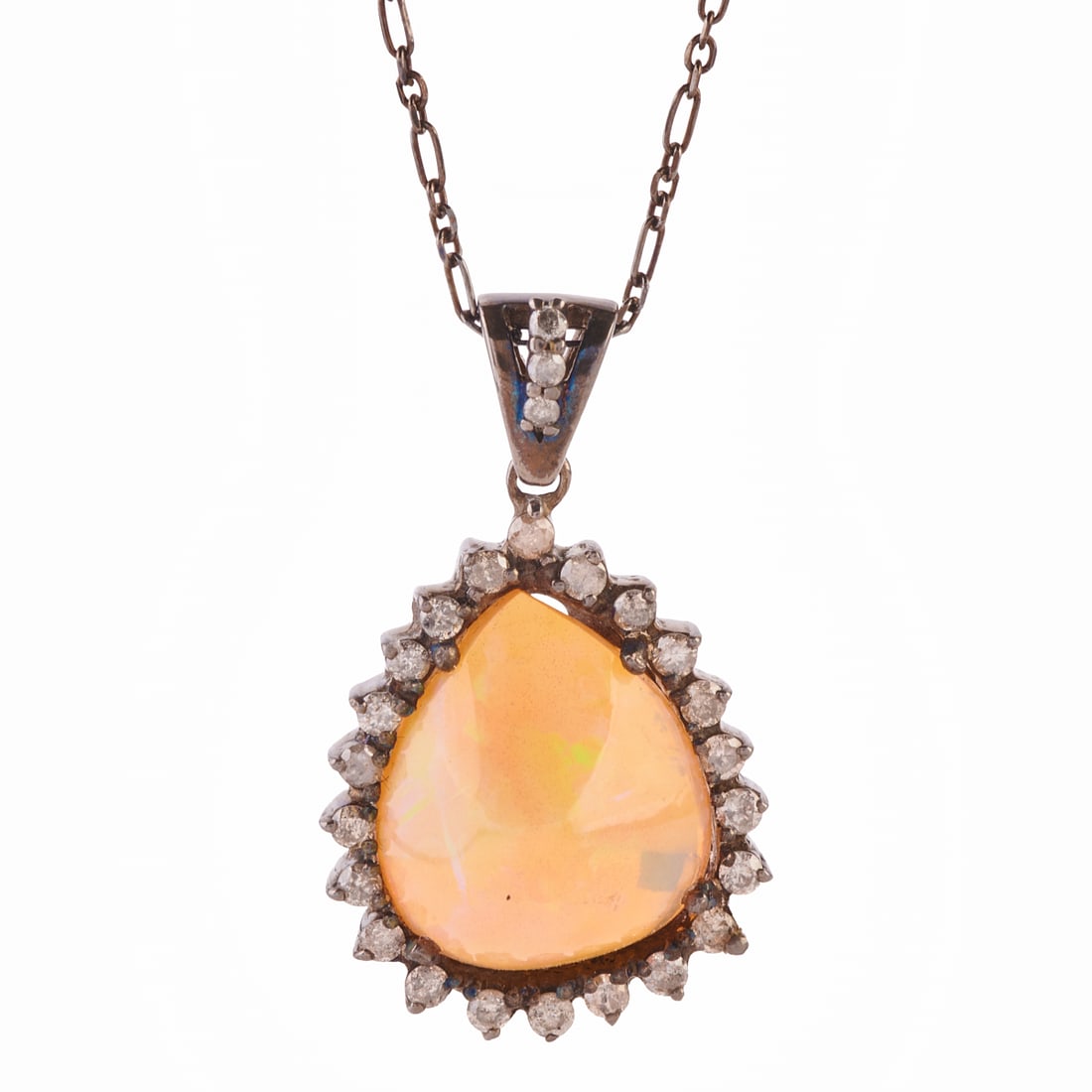 Opal, Diamond, Oxidized Silver Pendant Necklace: Opal, Diamond, Oxidized Silver Pendant Necklace. Featuring one pear shaped opal cabochon measuring approximately 19.6 x 16.5 x 10.4 mm, accented by twenty-five round-cut diamonds weighing a total of