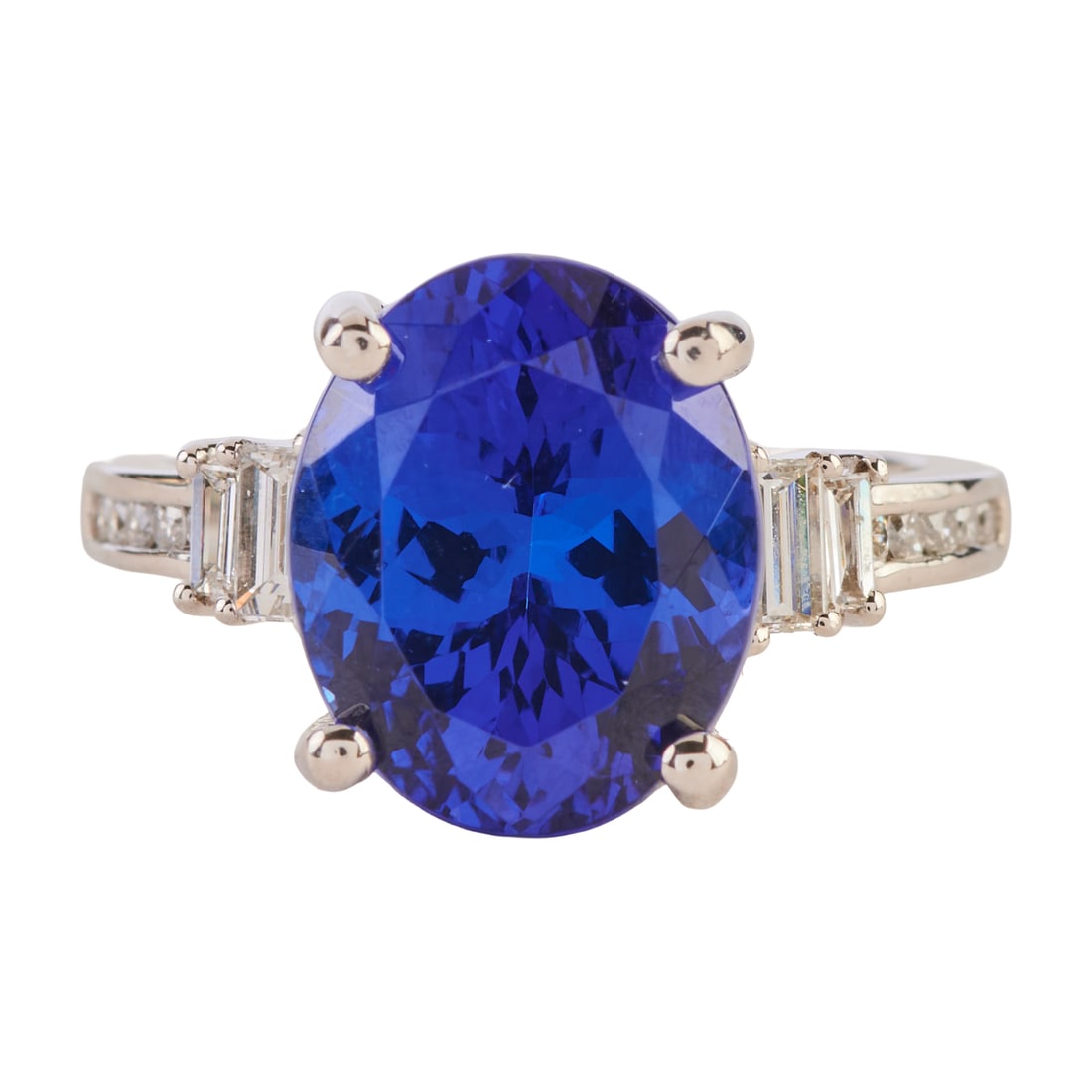 Rhapsody Tanzanite, Diamond, Platinum Ring: Rhapsody Tanzanite, Diamond, Platinum Ring. Featuring one oval-cut tanzanite weighing approximately 7.05 cts., accented by four baguette-cut and ten full-cut diamonds weighing a total of