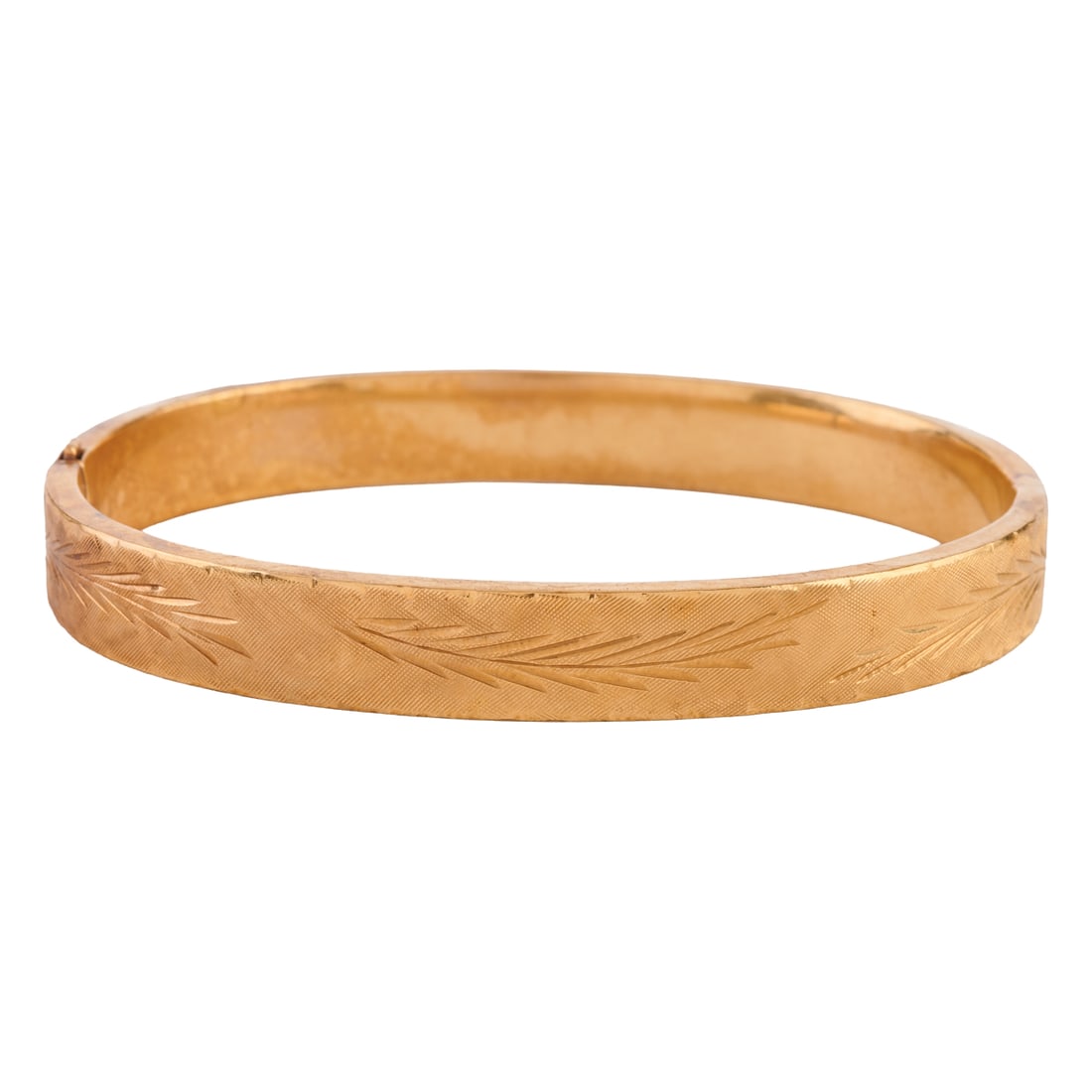 14k Yellow Gold Bracelet: 14k Yellow Gold Bracelet. The 14k yellow gold hinged bangle bracelet measuring approximately 8 mm in width and with an internal diameter of approximately 58 mm and featuring a foliate motif. {Gross