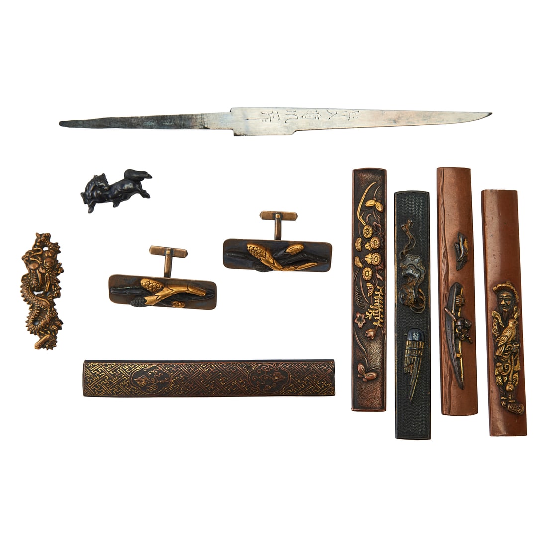 A Group of Japanese Kozuka and Menuki Articles: A group of Japanese Kozuka and Menuki articles.;{Approximate measurement;each handle: L 3 7/8 inches}.Provenance: From the collection of the distinguished San Francisco collector Irving Freedenberg, k