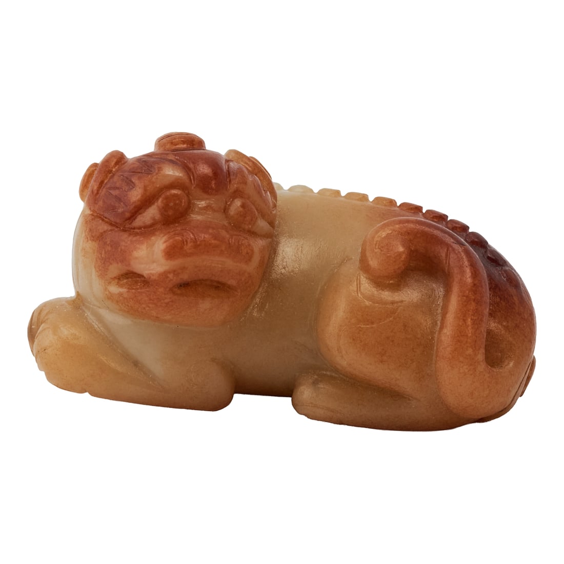 A Hetian Jade Carving of an Auspicious Beast, Qing Dynasty: A Hetian Jade Carving of an Auspicious Beast, Qing Dynasty. {L 2 1/4;x W 1 1/2 x D 1 1/8;inches}.Provenance: From the collection of the distinguished San Francisco collector Irving Freedenberg, known 