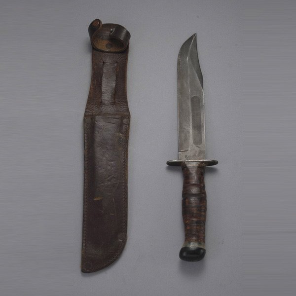 U.S.M.C. Mark 2 Fighting Knife by Ka-Bar: U.S.M.C. Mark 2 Fighting Knife by Ka-Bar, with Customized Handle, and Leather Scabbard 7-inch blackened clipped point blade, the ricasso with "Ka-Bar/Oiean, N.Y.," and "USMC." Leather washer grip, wit