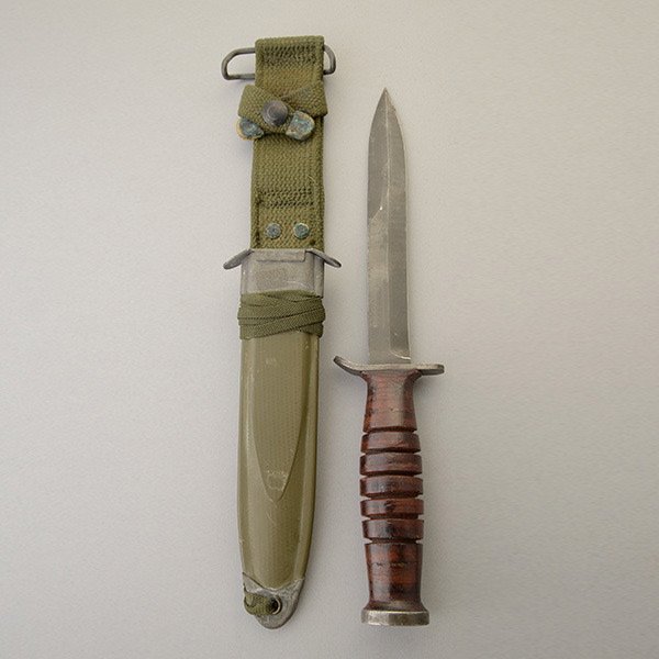 U.S. M-3 Fighting Knife Marked Utica: U.S. M-3 Fighting Knife Marked Utica, with Scabbard Overall length, 11 5/8-inches. "U.S./M-3" and "Utica" on crossguard. Standard scabbard. Very good.