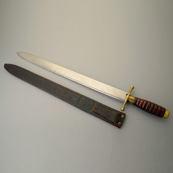 Collins & Co No. 289 Hospital Corps Machete: Collins & Co No. 289 Hospital Corps Machete. 17 1/4 inch straight blade with ricasso marked Collins & Co./Hartford/Cast Steel/Warranted/No 289. Brass crossguard and ferrule. One piece ribbed with wood