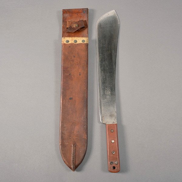 Military Machete by Kitchin: Military Machete by Kitchin, Sheffield, with Broad Arrow Mark and Leather Scabbard 14 5/8-inch long blade with Kitchin Ltd. marking and broad arrow with date 1952. Rust color composition grip panels.