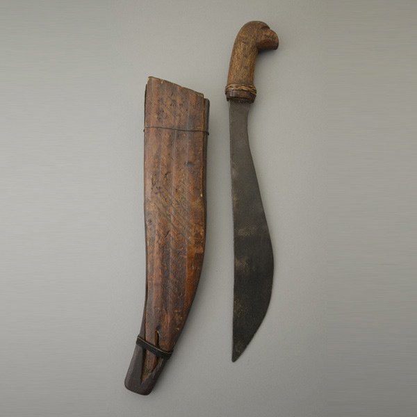 Tribal Machete: Well used tribal machete showing rust and pitting with wood scabbard