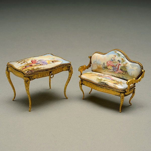 Royal Vienna Style Enamel Miniature Sofa and Desk: Two Vienna Style Enamel Gilt Metal Mounted Furniture Form Miniatures: a canape and a desk, each decorated with landscape vignettes of courting couples