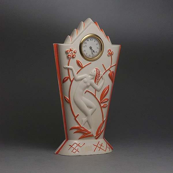 Czechoslovakian Art Deco Pottery Clock Case: Czechoslovakian Art Deco Pottery Clock Case with a German windup clock movement, the case with molded figural decoration #9269 {Height 12 1/2 inches}