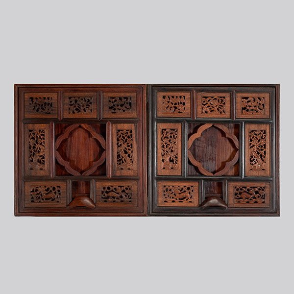 A Pair of Huanghuali and Mixed Wood Mirror Stands: A Pair of Huanghuali and Mixed Wood Mirror Stands, With reticulated decorative panels displaying blooming branches, prunus and rabbits with lingzhi, set within a thin darker frame surrounding the pier