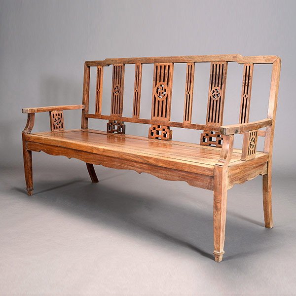 A Rosewood Bench with Buddhist Symbols: A Rosewood Bench with Buddhist Symbols, The open back with carved vertical panels containing swastika medallions above geometric scroll emblems, the shaped arms designed to match. 38 1/2 x 67 x 20 1/2