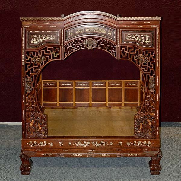 A Softwood Canopy Bed with Inlay Decoration: A Softwood Canopy Bed with Inlay Decoration, The front framed by an elaborately designed panel with openwork geometric meanders beneath intricately inlaid figural landscapes, further enclosed by side 