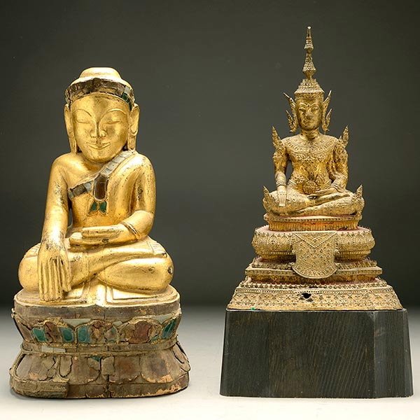 Two Southeast Asian Buddhas: Two Southeast Asian Buddhas, The first a Thai gilt-bronze Buddha with wood stand; the second a Cambodian carved and gilt-painted wood Buddha. Taller: 22 inches (56 cm) [Losses, cracks, overall wear. T
