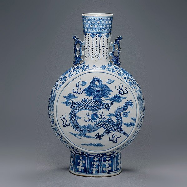 A Blue & White Moonflask, Kangxi Mark/19th Century: A Blue and White Moonflask, Featuring a front-facing dragon and a flaming pearl on each side, the base bearing a four-character mark. Kangxi Mark,19th Century, Height: 17 5/8 inches (44.8 cm) [Repairs
