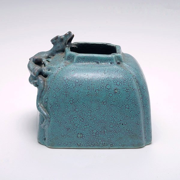A Robin's Egg Glazed Inkwell: A Robin's Egg Glazed Inkwell, Of square with a molded decoration of a chilong dragon. Height: 2 inches (5 cm)