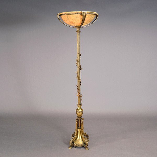 Beaux Arts Brass Torchere Form Floor Lamp: Beaux Arts Brass Torchere Form Floor Lamp with Onyx Shade, early 20th century, the pole standard cast with an entwining vine branch raised on goat hoof feet {Height 69 inches} Sold to benefit HIP Hous