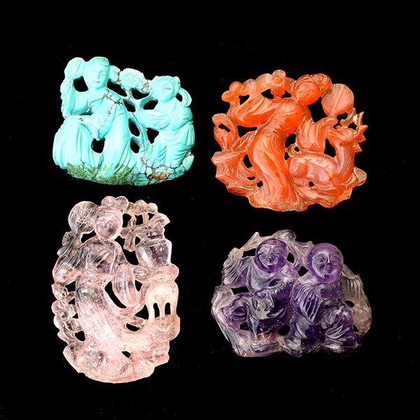 COLLECTION OF FOUR MULTI-STONE CARVINGS.: COLLECTION OF FOUR MULTI-STONE CARVINGS. Including one carved carnelian Quan Yuen measuring approximately 40 x 40 mm; one carved turquoise Quan Yuen measuring approximately 39 x 32 mm; one carved amet