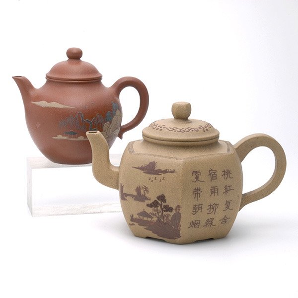 Two Yixing Clay Teapots: Two Yixing Clay Teapots, one of hexagonal form, one of globular form; both depicting landscape and description, marks to each base {Taller: 4 1/2 inches (11.5 cm)} [Crack]