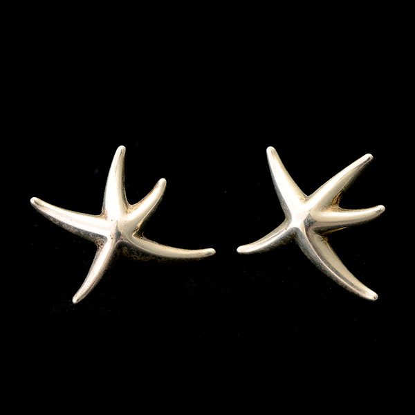 TIFFANY & CO. PERETTI STERLING SILVER EARRINGS.: PAIR OF TIFFANY & CO. ELSA PERETTI STERLING SILVER EARRINGS. The sterling silver starfish shaped earrings measuring approximately 25 mm and are post backed. {Gross Weight: 5.0 dwts} Note: Missing fric