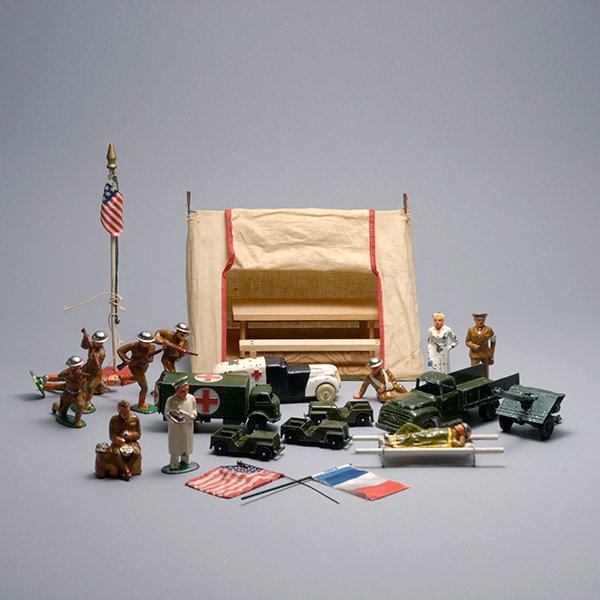 Lot of Dinky Military Toys:: Lot of Dinky Military Toys: three jeeps; two ambulances {longest length 5 inches; losses}; utility truck; artillery; mess hall with table and two benches {tent height 6 3/4 inches; length 8 1/2 inches