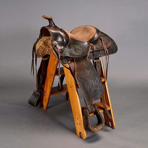 Don Cunningham Vintage Roping Saddle: Vintage Don Cunningham Roping Saddle, a skirted saddle, with fenders and stirrups, marked "Don Cunningham Orange Calif" {Total length 27 inches}