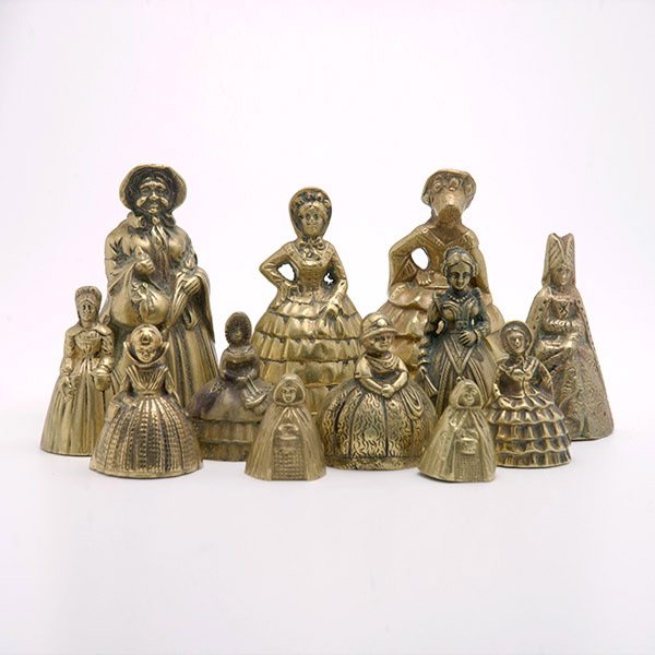 Twelve English Brass Figural Bells,: Twelve English Brass Figural Bells, Including two with feet as ringer {Height of tallest 5 inches}