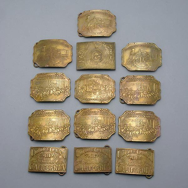 13 American Express and Western Themed Belt Buckles: Group of Thirteen American Express and Western Themed Belt Buckles: Including five Central and Union Pacific Railroad Company {dimensions 3 3/4 x 2 3/4 inches}; three American Express Company, with st