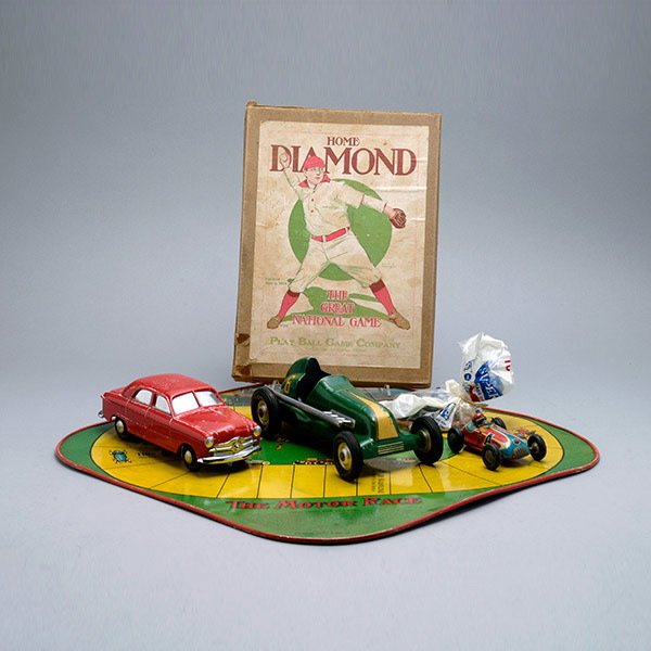 Group of Sports and Racing Related Vintage Toys:: Group of Sports and Racing Related Vintage Toys: Including a tin lithographed Motor Race with spinner and cars; boxed Home Diamond baseball game, 1913; and three cars: rocket race car; thimble drome s