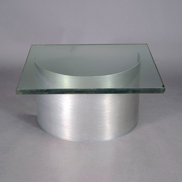 Modernist Aluminum Base Table with Glass Top.: Modernist Curved Aluminum Base Table with Glass Top. Measures approximately 15 inches in height by 30 inches square. Glass top measures approximately 1/4 inch in thickness.