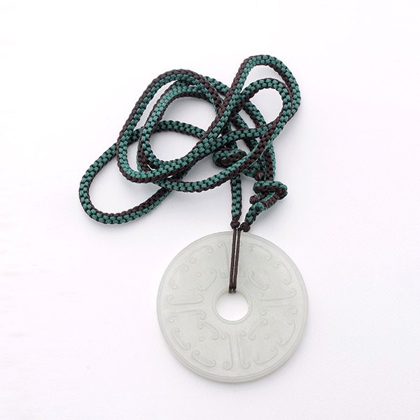 A White Jade Bi Disk, 18th/19th C.: A White Jade Bi Disk, Carved to side with alternating ruyi-shaped motifs and dots, and the reverse carved with a field of tiny bosses between narrow inner and outer borders. 18th/19th Century, Diamete