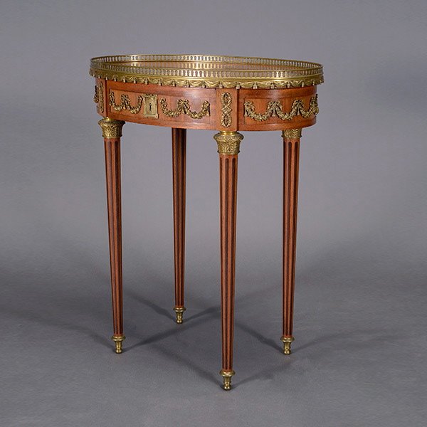 Krieger Louis XVI Style Gilt Bronze Gueridon: Louis XVI Style Gilt Bronze Mounted Gueridon. The oval shape with a gilt pierced balustrade over an integrated draped and tasseled swag surround above a frieze with floral swag mounts, each tapering c