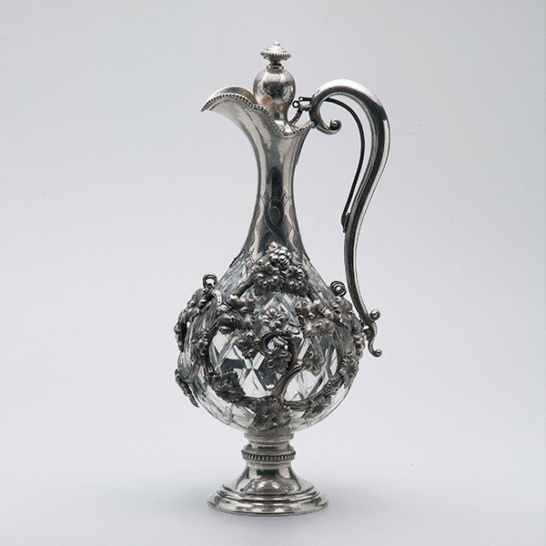 800 Standard Mounted Cut Glass Claret Jug: Continental 800 Standard Silver Mounted Cut Glass Claret Jug in The Islamic Taste. The elegant pear form ewer cast with a long slender neck ending in a beaded rim, an auricular handle with leafy tendr