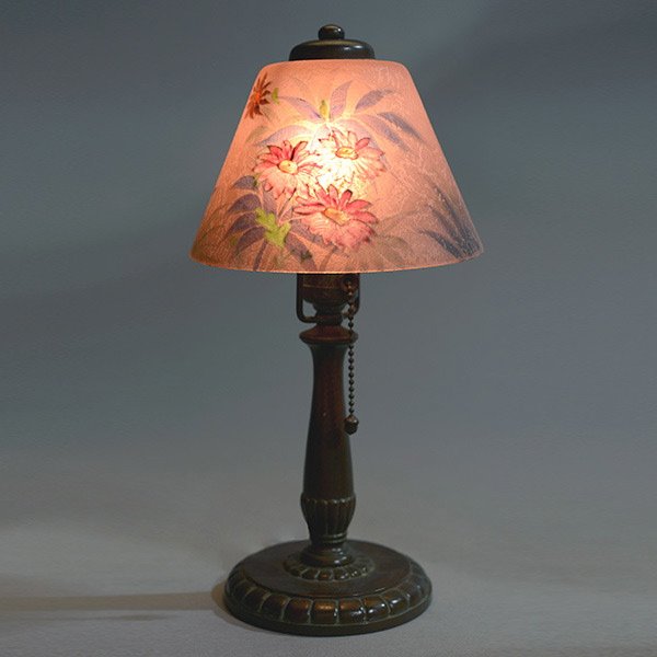 Handel Reverse Painted Boudoir Lamp: Handel Reverse Painted Boudoir Lamp. The domical shade with a pale pink chipped glass exterior, reverse painted on the interior sides with a continuous design of sprays of chrysanthemum blossoms; on a
