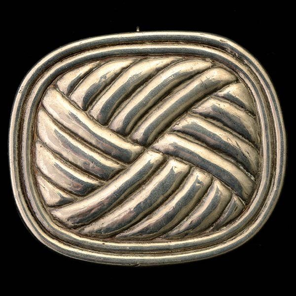 WILLIAM SPRATLING STERLING SILVER PENDANT BROOCH.: WILLIAM SPRATLING STERLING SILVER PENDANT BROOCH. Featuring a woven knot with a frame measuring approximately 78 x 65 mm. {Gross Weight: 37.2 dwts} Note: Modified function.
