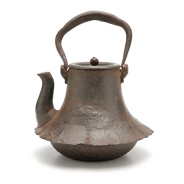 A Japanese Cast-Iron Tea Kettle: A Japanese Cast-Iron Tea Kettle, the flaring body decorated with a faint landscape and flying birds, floriform finial, signed Ryubundo {Height: 4 3/4 inches (12 cm) excluding handle} [Repairs, overall