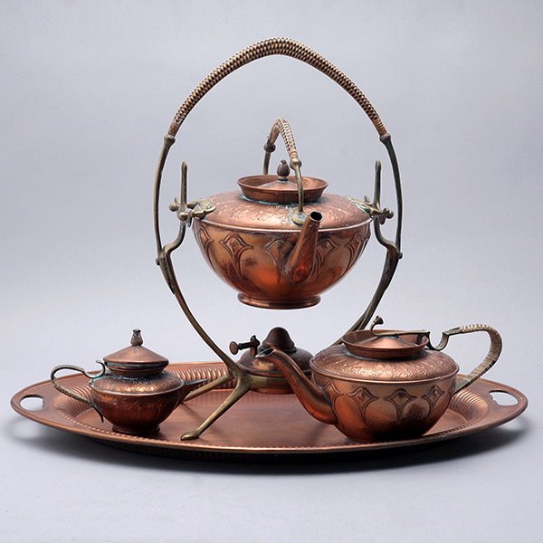 Art Nouveau Copper Four Piece Tea Service:: Art Nouveau Copper Four Piece Tea Service: Comprising kettle on stand {height 16 inches}; teapot; hot milk jug; and tray {length 21 inches}