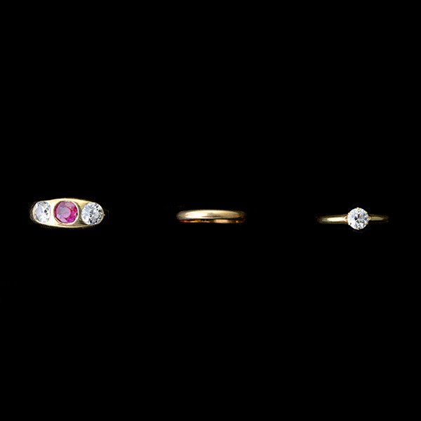 THREE DIAMOND, RUBY, YELLOW GOLD RINGS.: COLLECTION OF THREE DIAMOND, RUBY, YELLOW GOLD RINGS. Including one diamond, 18k yellow gold engagement ring, size 4 1/2; one Shreve & Co. 14k yellow gold band, size 3 1/4 together with one ruby, diam