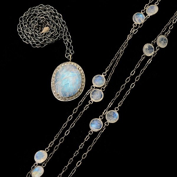 TWO MOONSTONE, DIAMOND, SILVER NECKLACES.: COLLECTION OF TWO MOONSTONE, DIAMOND, SILVER NECKLACES. Including one rose-cut moonstone, diamond, blackened silver pendant 24 inch necklace together with a round-cut moonstone, blackened silver 48 "b