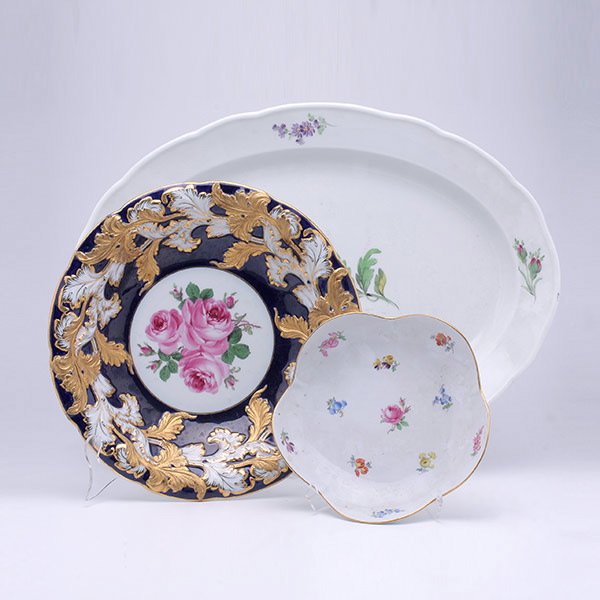 Three Meissen Serving Dishes: Three Meissen Serving Dishes, a platter with deutsche blumen decoration {length 19 inches}; a gilt rimmed cobalt bowl; and a scalloped edge bowl [platter with scratched Meissen scepter mark]