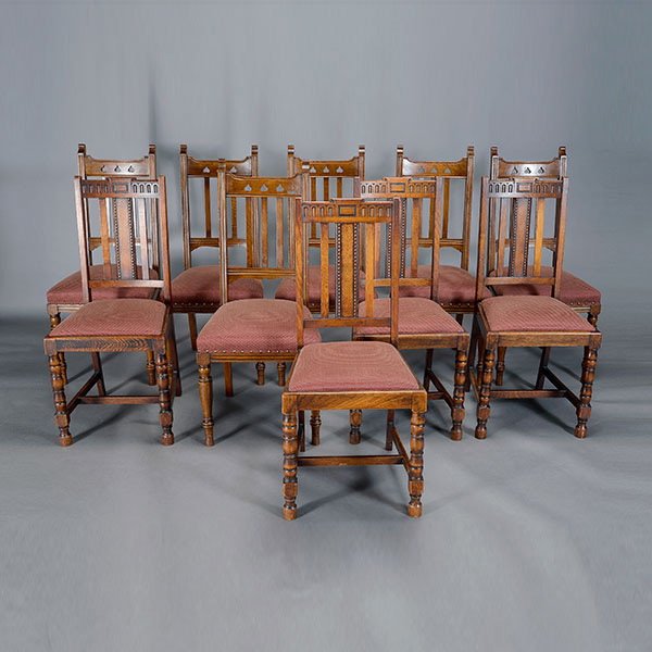 Suite of Ten English Oak Dining Chairs:: Associated Suite of Ten English Oak Dining Chairs: Comprising six in the Arts & Crafts style with leaf pierced decoration, and four Deco style chairs {Height of chair with leaf decoration 41 x 18 1/2 