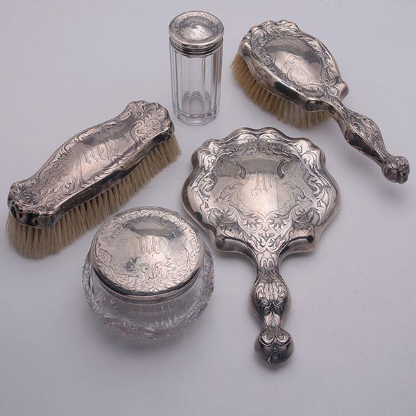 Art Nouveau Blackinton 5 Pc Sterling Dresser Set: Art Nouveau Blackinton Sterling Five Piece Dresser Set, each piece centering a lion flanked by a scroll crest with "M" monogram: comprising a hand mirror {length 10 3/4 inches}, a clothes brush, a hai