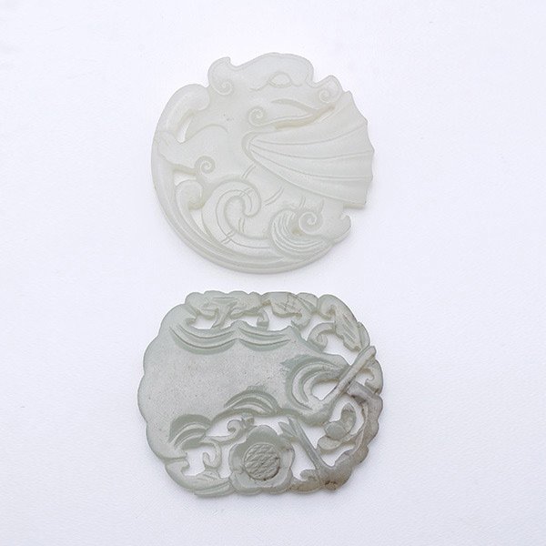 Two Jade Plaques, Qing Dynasty: Two Jade Plaques, The first of circular form carved as a mythical beast, the second of rounded rectangular form and carved as a flowering prunus tree. Qing Dynasty, Longest: 2 3/16 inches (5.4 cm) [Ch