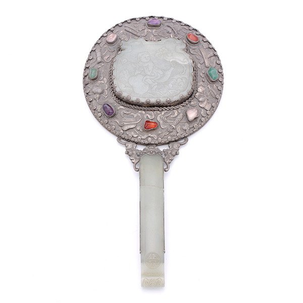 A Silver-Mounted Jade Hand Mirror, Early 20th C.: A Silver-Mounted Jade Hand Mirror, The celadon jade hairpin forming the handle, a rectangular celadon plaque carved with a figure riding a double gourd, encircled by the Eight Buddhist Emblems alterna