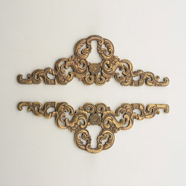 Two Gilt-Bronze Hangers: Two Gilt-Bronze Hangers, Each cast with a stylized lotus flower decoration. Length: 7 3/8 inches (18.7 cm) each