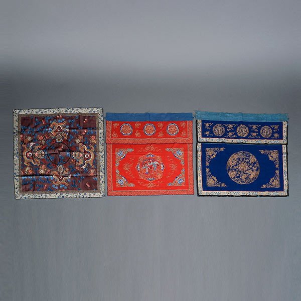 A Group of Three Textiles, 19th C.: A Group of Three Textiles, The first a panel embroidered with four front-facing golden dragons against a brown ground; the second a blue-ground hanging panel with couched gilt-wrapped threads depictin